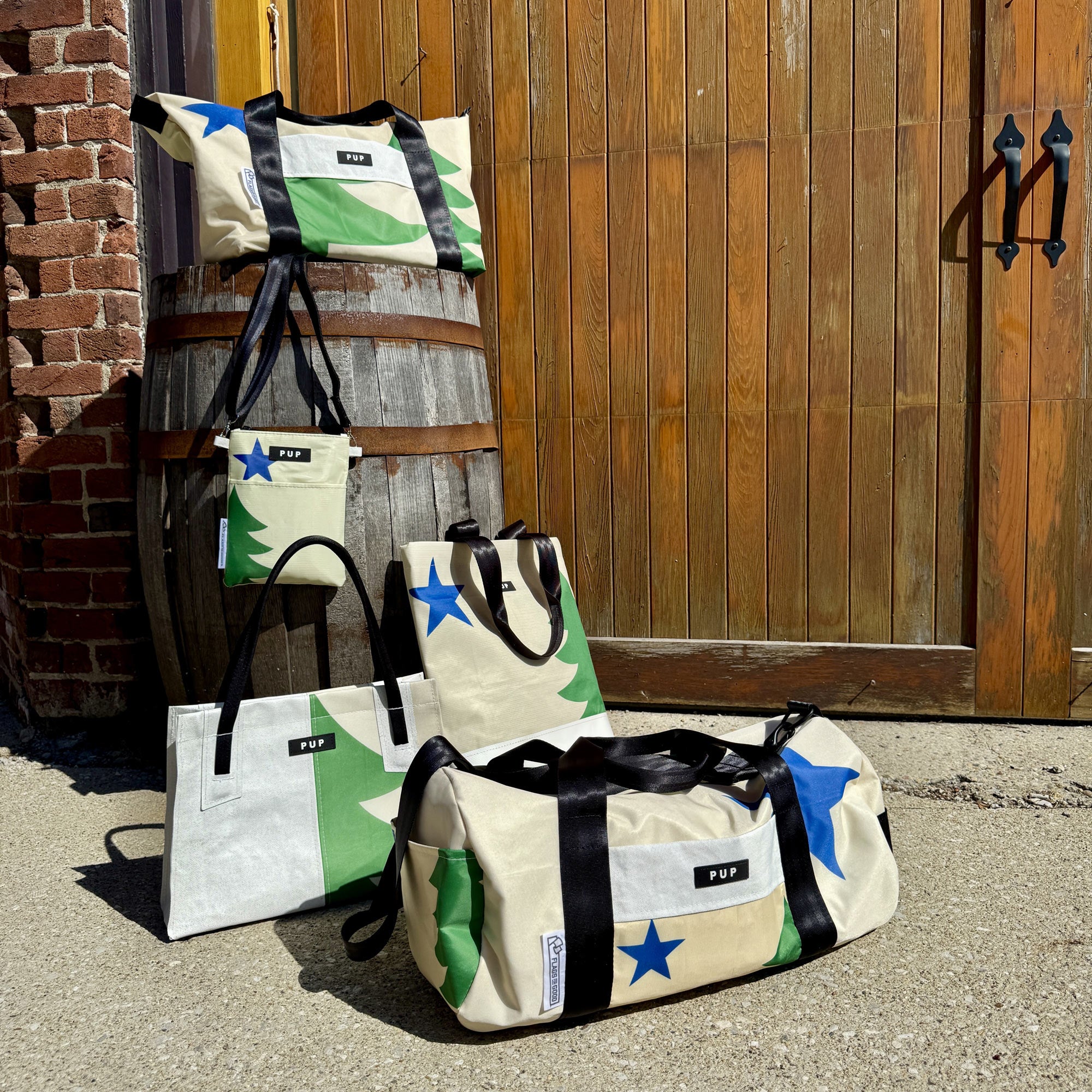 five fashion bags made from repurposed Maine flags