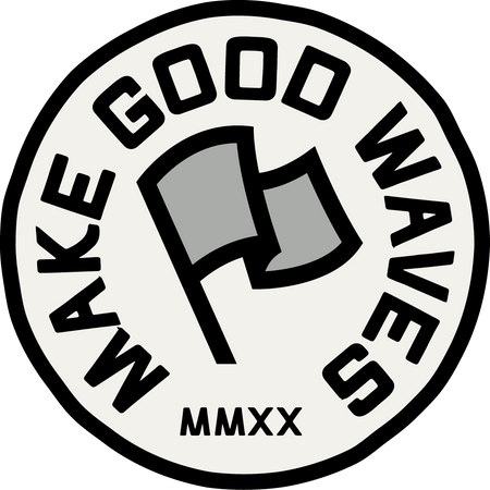 Circular logo with 'Make Good Waves' text and a flag graphic on a white background