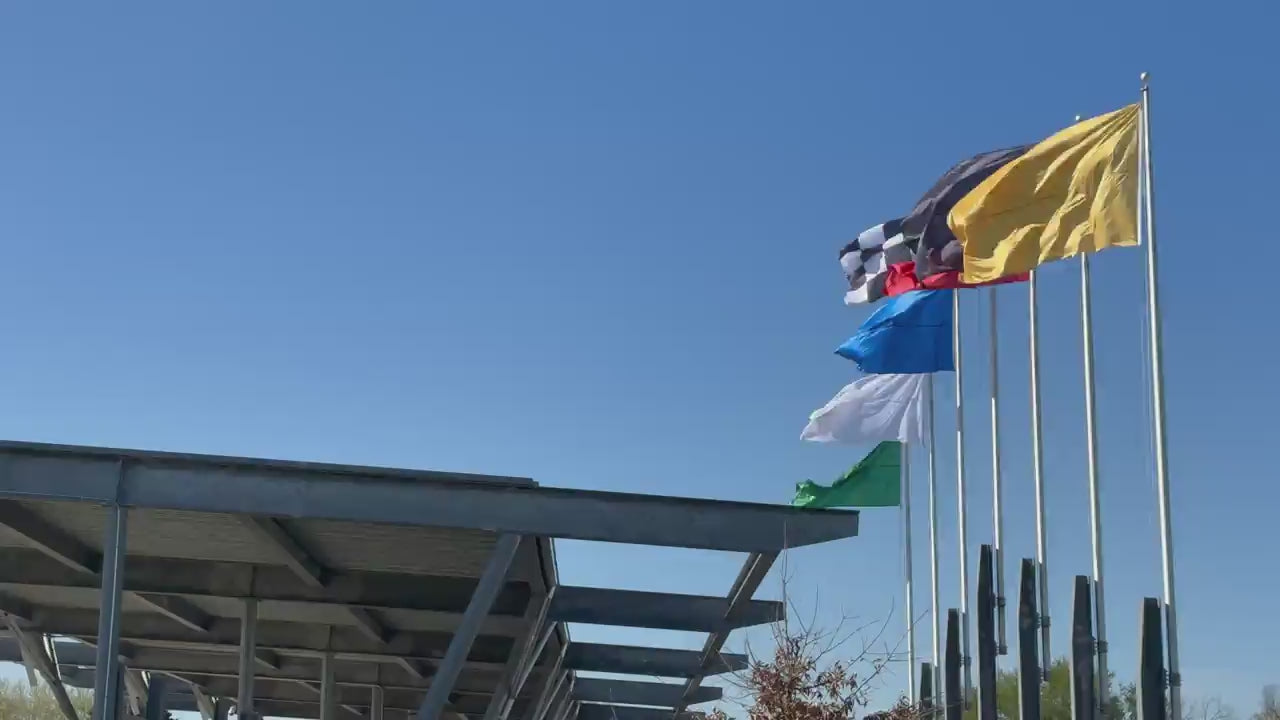 flags flying at the Indianapolis Motor Speedway