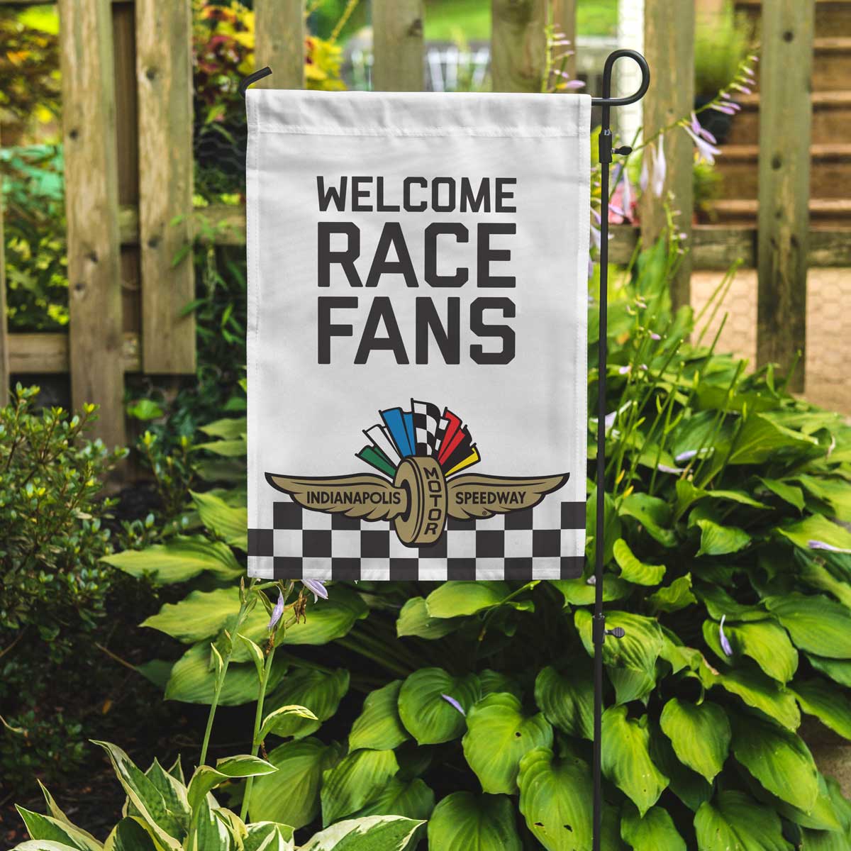 Garden flag with Indianapolis Motor Speedway logo and 'Welcome Race Fans!' text on a white background with checkerboard along the bottom.