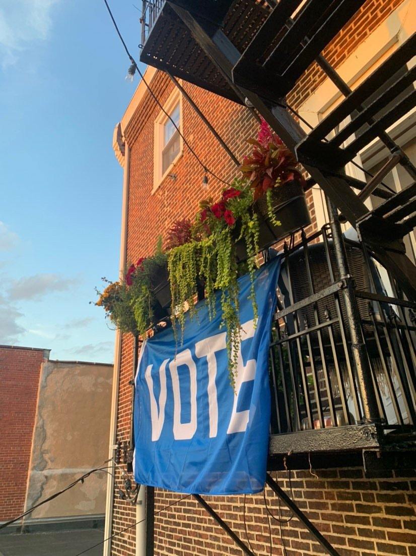 "Vote" Flag hanging on a balcony